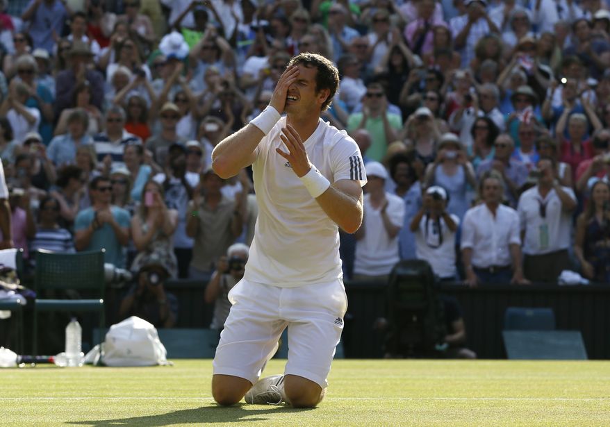 Andy Murray of Britain reacts after winning against Novak Djokovic of Serbia in the Men's singles final match at the All England Lawn Tennis Championships in Wimbledon, London, Sunday, July 7, 2013. (AP Photo/Kirsty Wigglesworth)