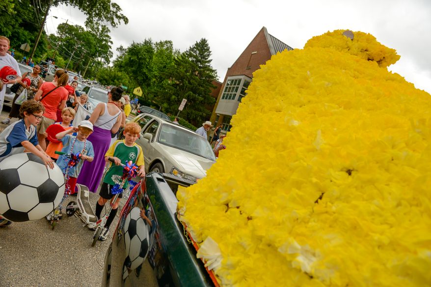 Children check out John ReVeal's Peeps float as parade vehicles get ready to leave for the Palisades July 4th Parade, Washington, D.C., Thursday, July 4, 2013. (Andrew Harnik/The Washington Times)