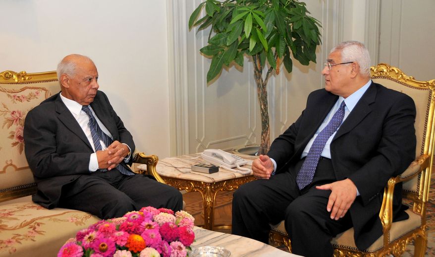 Egyptian Interim President Adly Mansour (right) meets with Hazem el-Beblawi in Cairo on Tuesday, July 9, 2013. Mr. Mansour has appointed Mr. el-Beblawi, a prominent economist, as prime minister. (AP Photo/Egyptian Presidency)