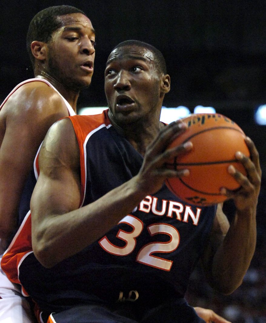 **FILE** Auburn's Korvotney Barber (32) looks toward the basket as Arkansas' Darian Townes, left, defends during the first half of a college basketball game in Fayetteville, Ark., Wednesday, Feb. 7, 2007. (AP Photo/April L. Brown)