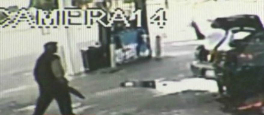A woman in Houston shot and killed a man who lunged at her with a knife in his hand, Tuesday, July 23, 2013. (KHOU 11 News screenshot)