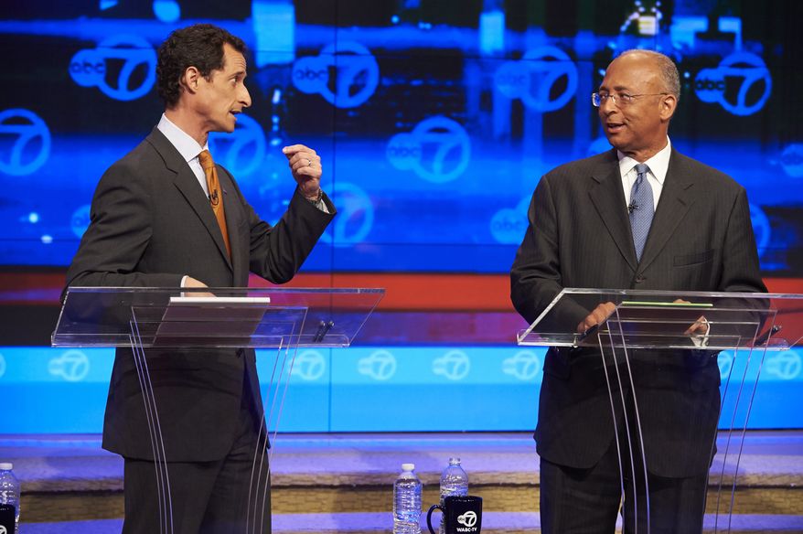 New York City Democratic mayoral candidates Anthony Weiner, left, addresses fellow candidate Bill Thompson during the first primary debate for New York City mayor in the WABC/Channel 7 studios, Tuesday, Aug. 13, 2013, in New York. The debate was hosted by The League of Women Voters of the City of New York, The New York Daily News, plus television stations Univision 41, Noticias, and WABC channel 7. (AP Photo/New York Daily News, James Keivom, Pool)