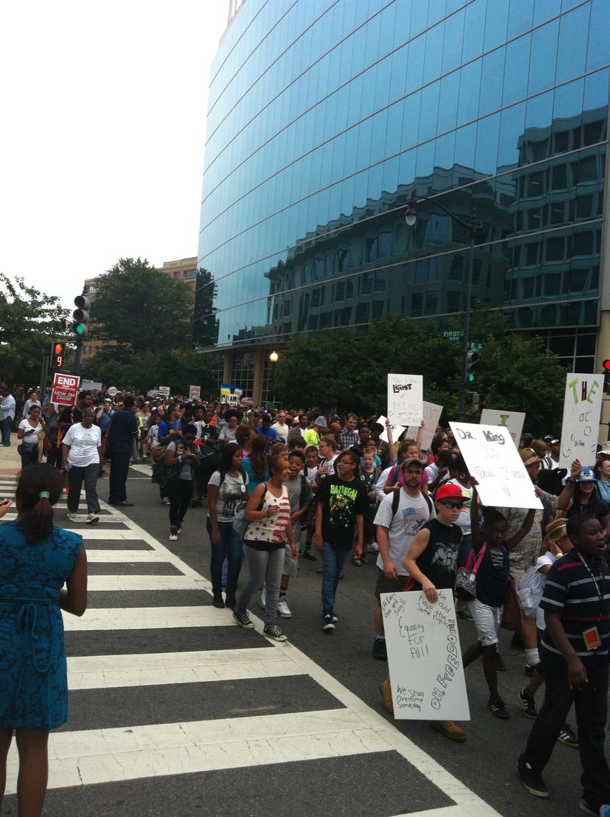 Hundreds take to the streets of Northwest D.C. for a morning event honoring the 1963 March on Washington (Andrea Noble/The Washington Times)