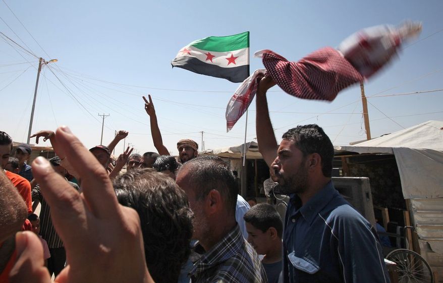 Although Syrian refugees are calling for the ouster of President Bashar Assad, a growing number of jihadist organizations are fighting to take his place. (Associated Press)