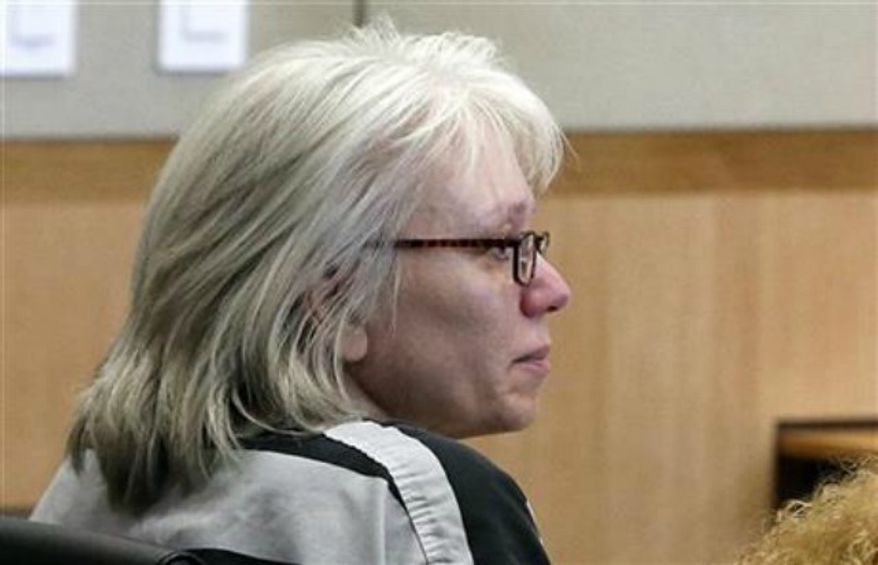 Debra Jean Milke listens to a judge during a hearing as she awaits a retrial in the 1989 shooting death of her 4-year-old son, Christopher, at Maricopa County Superior Court in Phoenix, Aug. 1, 2013. A judge is allowing Milke to be released on bail as she awaits retrial in the 1989 killing of her young son, a case that had her on death row since 1990 until her conviction was overturn this year. (AP Photo/Ross D. Franklin, Pool, File)