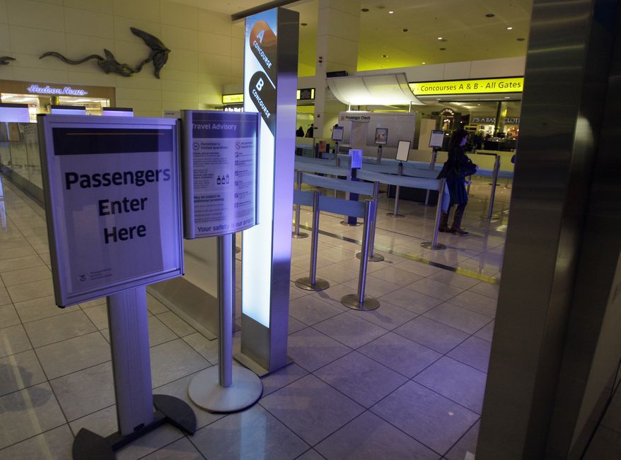 **FILE** A passenger enters the security line at Baltimore-Washington International Thurgood Marshall Airport on Dec. 29, 2009. (Associated Press)