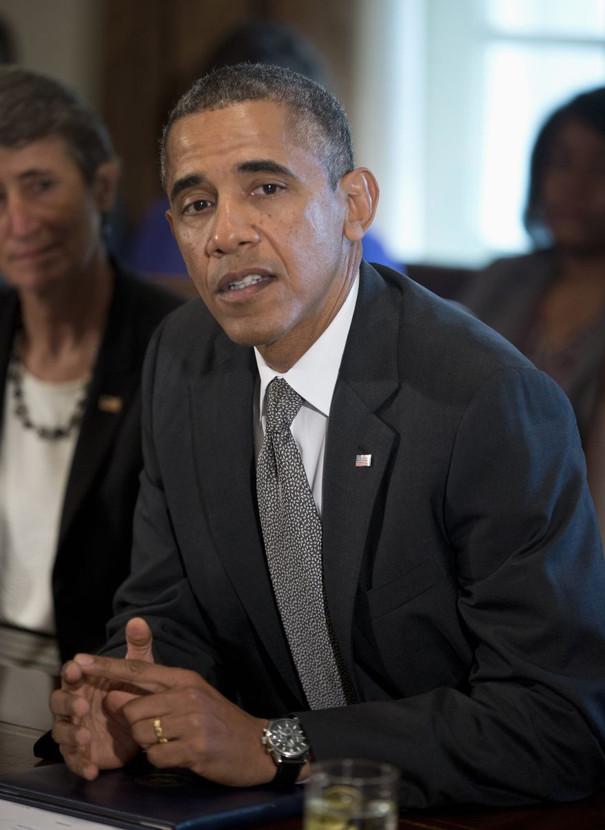 President Obama speaks to members of the media before a cabinet meeting on Sept. 12, 2013, in the Cabinet Room of the White House in Washington. At left is Interior Secretary Sally Jewell. (Associated Press)