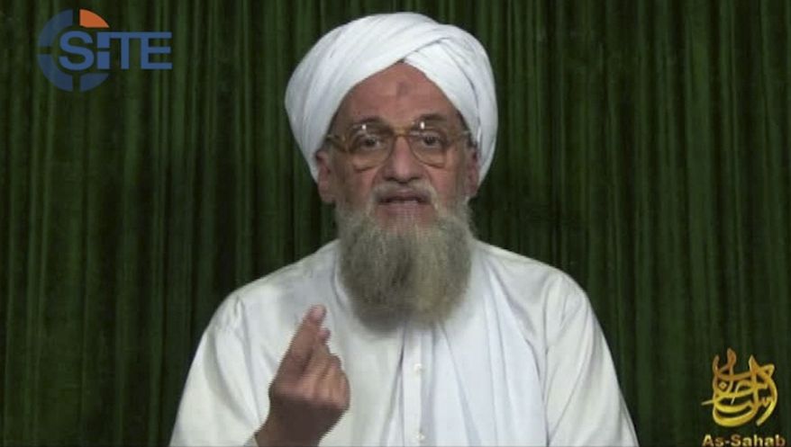** FILE ** This file image from video the AP obtained Feb. 12, 2012, from the SITE Intel Group, an American private terrorist threat analysis company, shows al Qaeda's leader Ayman al-Zawahri in a web posting by al Qaeda's media arm, as-Sahab, calling on Muslims across the Arab world and beyond to support rebels in Syria who are seeking to overthrow President Bashar Assad. Al-Zawahri marked the 12th anniversary of the Sept. 11, 2001, attacks by calling on Muslims to strike inside the United States, using any opportunity they can to "bleed" America financially, speaking in an audio message released Thursday, Sept. 12, 2013. (AP Photo/SITE Intel Group, File)