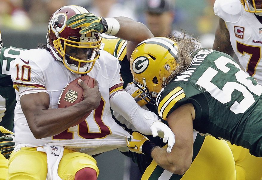 Washington Redskins quarterback Robert Griffin III (10) is sacked by Green Bay Packers outside linebacker Clay Matthews during the first half of an NFL football game Sunday, Sept. 15, 2013, in Green Bay, Wis. (AP Photo/Tom Lynn)