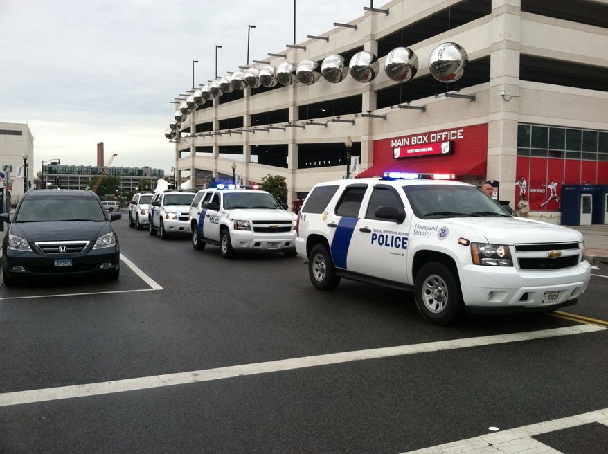 Families and law enforcement gather at Nationals Park near the Navy Yard. (Meredith Somers/The Washington Times)