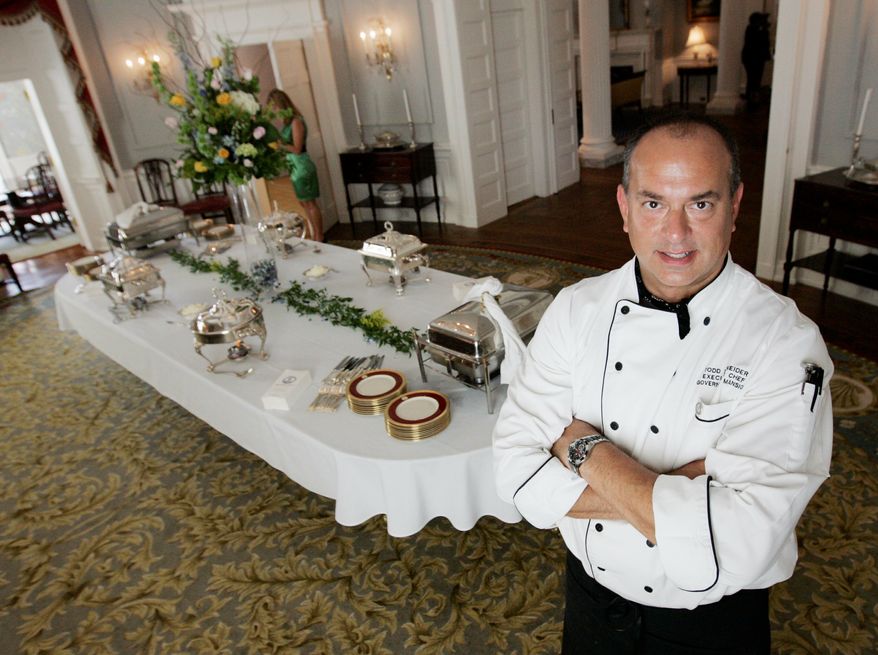 In this July 14, 2010 photo, Executive chef Todd Schneider poses in the dining room of the Executive Mansion in Richmond, Va. Schneider the former chef at Virginia's executive mansion has been indicted on four felony counts of embezzlement. Todd Schneider was arrested Thursday, March 27, 2012 by Virginia State Police on the indictments handed up last week in Richmond Circuit Court. (AP Photo/Richmond Times-Dispatch, Joe Mahoney)