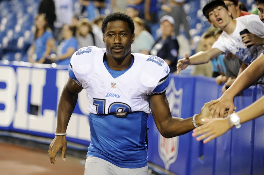 FILE - In this Aug. 29, 2013 file photo, Detroit Lions wide receiver Nate Burleson (13) walks away from fans after signing autographs after an NFL football game against the Buffalo Bills in Orchard Park, N.Y. The Detroit Lions say Burleson was in a one-car accident and needs surgery on a broken arm. The team said in a statement Tuesday morning, Sept. 24, 2013, that the police have confirmed alcohol was not involved. (AP Photo/Gary Wiepert, File)