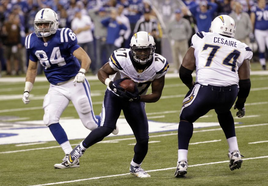 ** FILE ** In this Nov. 28, 2010, file photo, San Diego Chargers safety Paul Oliver (27) grabs a fumble during an NFL football game against the Indianapolis Colts in Indianapolis. A medical examiner near Atlanta says Oliver has committed suicide. Cobb County investigators say the 29-year-old Oliver was found dead Tuesday night, Sept. 24, 2013, at his home in Marietta, about 20 miles northwest of downtown Atlanta. Police say Oliver died of a self-inflicted gunshot wound. (AP Photo/AJ Mast, File)