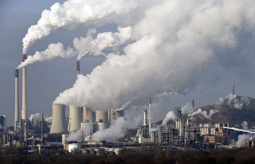** FILE ** In this Dec. 16, 2009, file photo, steam and smoke rises from a coal power station in Gelsenkirchen, Germany. Scientists are more confident than ever that pumping carbon dioxide into the air by burning fossil fuels is warming the planet. By how much is something governments and scientists meeting in Stockholm will try to pin down with as much precision as possible Friday, Sept. 27, 2013, in a seminal report on global warming. (AP Photo/Martin Meissner, File)