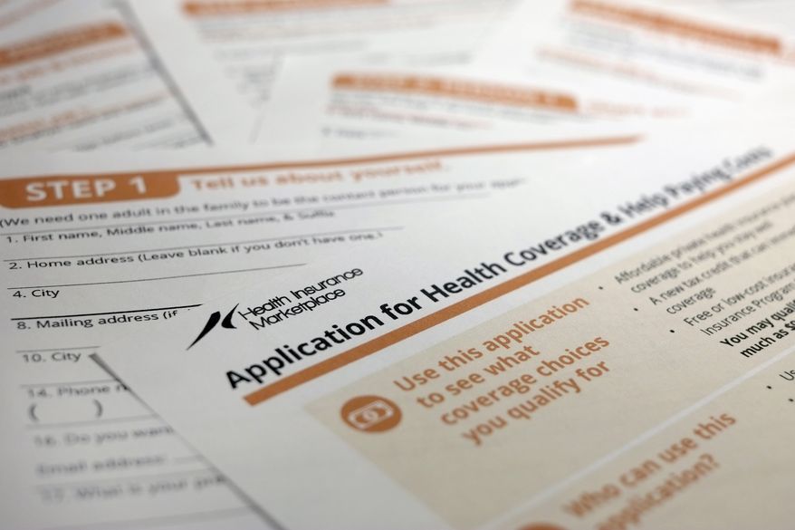 FILE - This Sept. 11, 2013 file photo shows the federal government form for applying for health coverage, in Washington. Getting covered through President Barack Obama’s health care law might feel like a combination of doing your taxes and making a big purchase that requires research. You’ll need accurate income information for your household, plus some understanding of how health insurance works, so you can get the financial assistance you qualify for and pick a health plan that’s right for your needs. (AP Photo/J. David Ake, File)