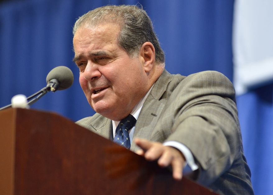 ** FILE ** Supreme Court Justice Antonin Scalia responds to a question during his appearance in part of a lecture series at Tufts University, Wednesday, Oct. 2, 2013, in Medford, Mass. (AP Photo/Josh Reynolds)