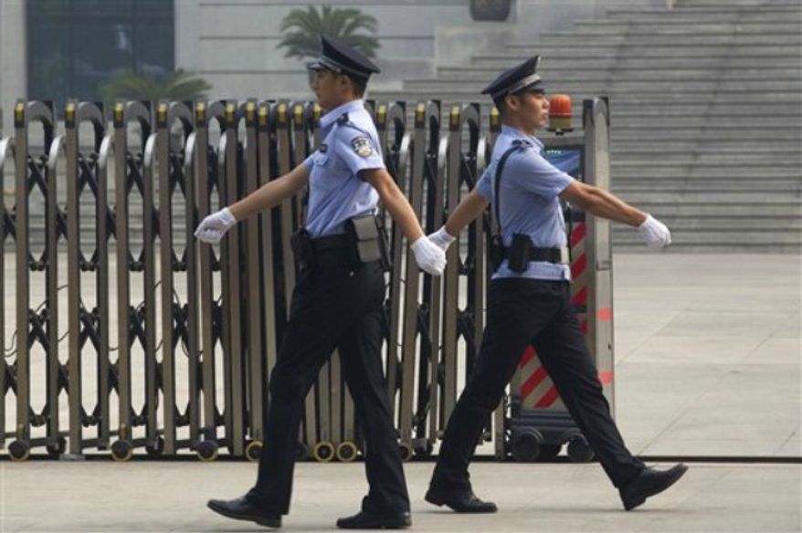 ** FILE ** Chinese police officers. (Associated Press)