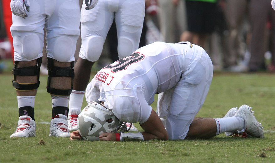 Maryland's starting quaterback C.J. Brown lies injured in the second quarter of an NCAA college football game against Florida State on Saturday, Oct. 5, 2013, in Tallahassee, Fla. Florida State 63-0. (AP Photo/Steve Cannon)