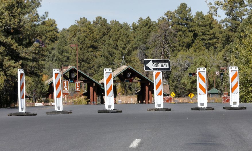 The Grand Canyon National Park entrance is blocked off on Tuesday, Oct. 8, 2013, in Tusayan, Ariz. The Grand Canyon remains closed to visitors because of the partial government shutdown. (AP Photo/Matt York)