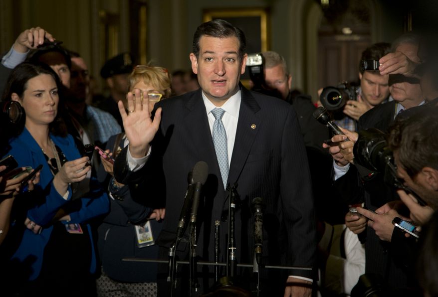 Sen. Ted Cruz, R-Texas, gestures as he talks with reporters on Capitol Hill, Wednesday, Oct. 16, 2013, in Washington. Sen. McConnell and his Democratic counterpart, Senate Majority Leader Harry Reid, D-Nev., are optimistic about forging an eleventh-hour bipartisan deal preventing a possible federal default and ending the partial government shutdown after Republican divisions forced GOP leaders to drop efforts to ram their own version through the House. (AP Photo/Carolyn Kaster)