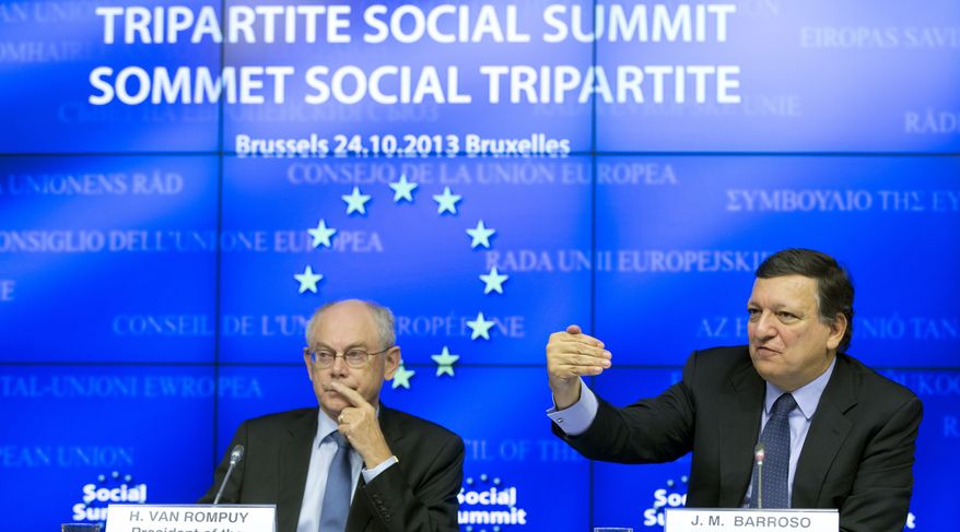 European Union Council President Herman Van Rompuy, left, and European Union Commission President Jose Manuel Barroso participate in a media conference during an EU summit in Brussels on Thursday, Oct. 24, 2013. The two-day summit meeting of EU leaders is likely to be diverted from its official agenda, economic recovery and migration, after German Chancellor Angela Merkel complained to U.S. President Barack Obama that U.S. intelligence may have monitored her mobile phone. (AP Photo/Virginia Mayo)