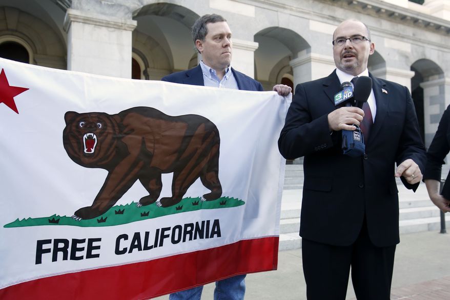 Assemblyman Tim Donnelly, R-Twin Peaks, right, flanked by Tim Knight, who led the recall movement in Colorado against two state legislators for the votes on gun control laws, announced that they are considering a recall campaign against five Democratic state lawmakers for their support of gun control bills in California, during a news conference in Sacramento, Calif., Thursday, Oct. 24, 2013. (AP Photo/Rich Pedroncelli)