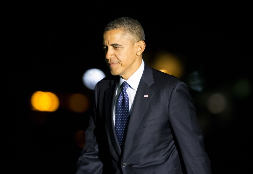 President Barack Obama arrives on the South Lawn of the White House after a trip to New York for a speech on education, and fundraising events on Friday, Oct. 25, 2013 in Washington. (AP Photo/ Evan Vucci)