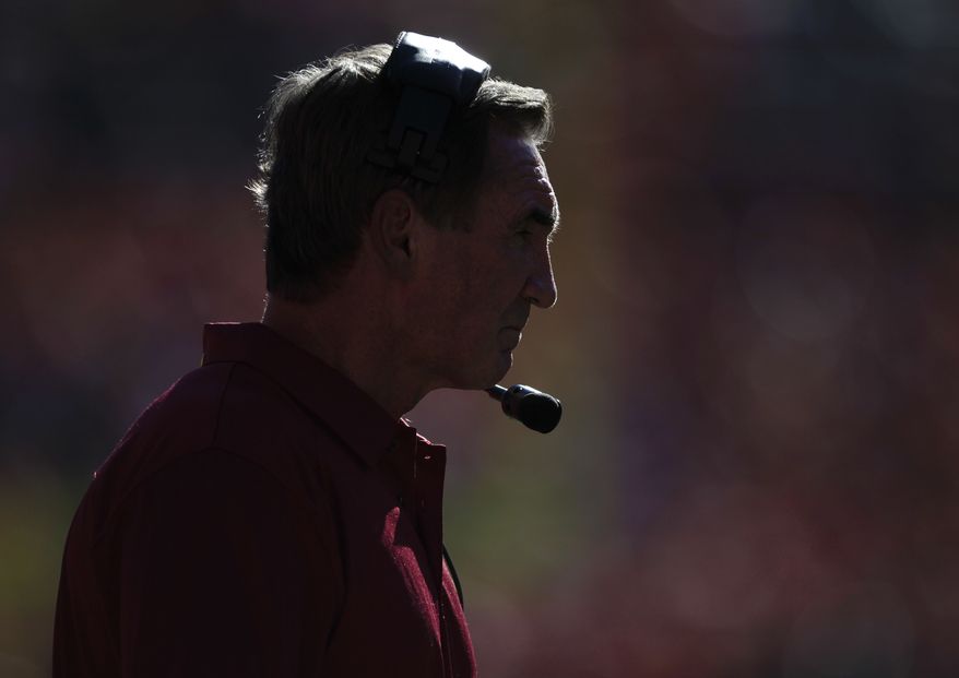 Washington Redskins Mike Shanahan watches play against the Denver Broncos from the sidelines in the second quarter of an NFL football game, Sunday, Oct. 27, 2013, in Denver. (AP Photo/Joe Mahoney)