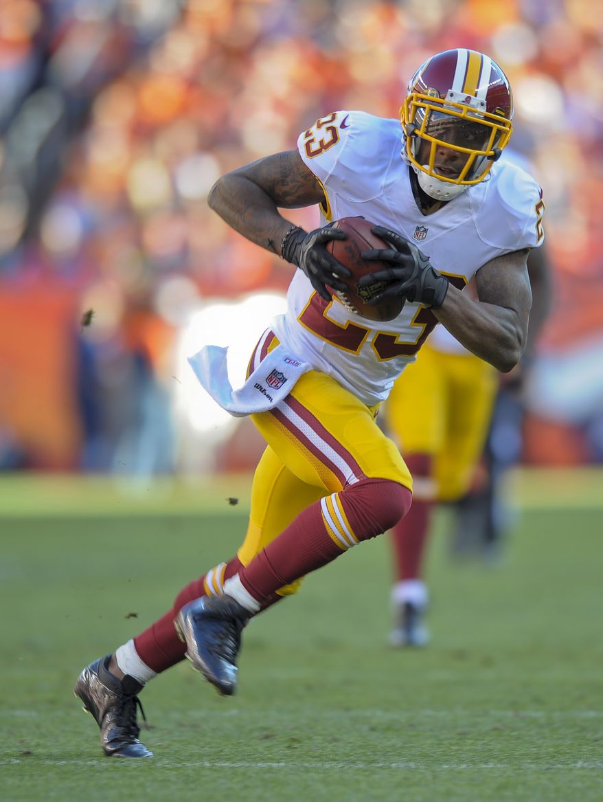 Washington Redskins cornerback DeAngelo Hall (23) runs back an interception fora touchdown against the Denver Broncos in the third quarter of an NFL football game, Sunday, Oct. 27, 2013, in Denver. (AP Photo/Jack Dempsey)