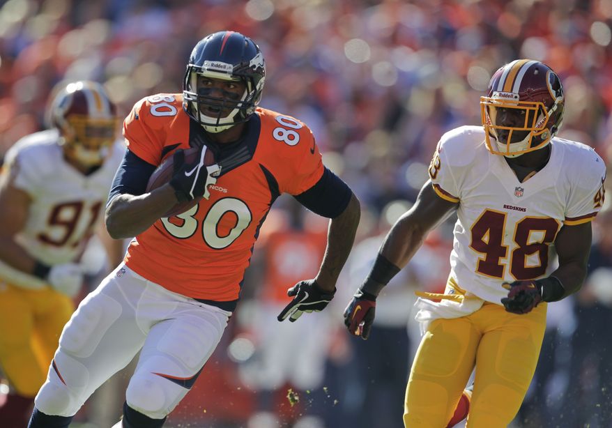 Denver Broncos tight end Julius Thomas (80) runs down field against Washington Redskins defensive back Jose Gumbs (48) in the first quarter of an NFL football game, Sunday, Oct. 27, 2013, in Denver. (AP Photo/Joe Mahoney)