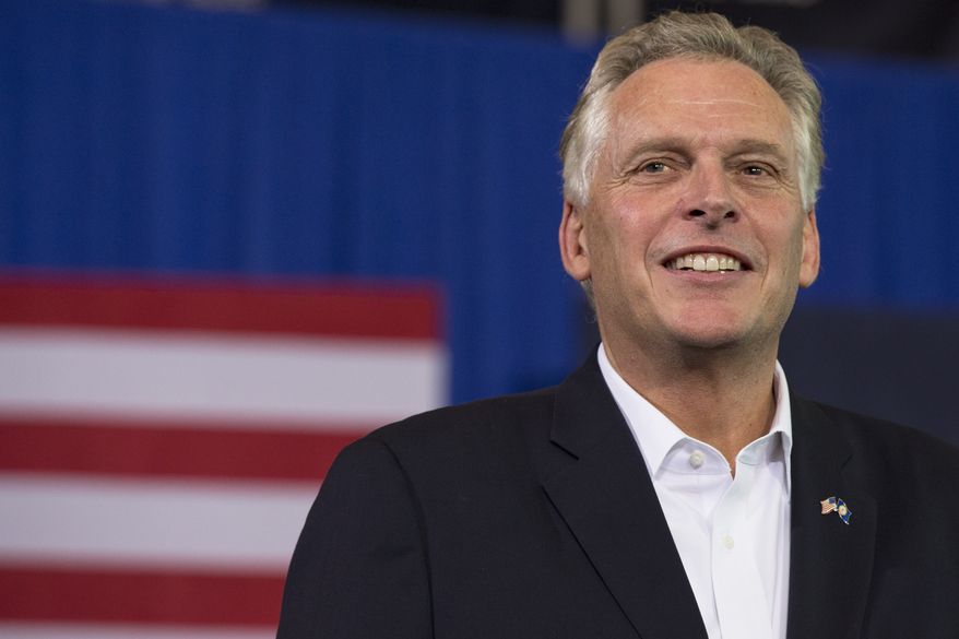 Virginia Democratic gubernatorial candidate Terry McAuliffe smiles during his campaign event at Washington-Lee High School in Arlington, Va. on Sunday, Nov. 3, 2013. President Barack Obama also attended the event. (AP Photo/Jacquelyn Martin)