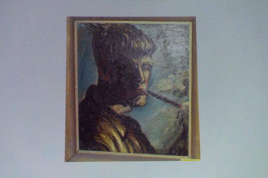 A painting of Otto Dix "Selbstportrait Rauchend" ("Selfportrait Smoking") is projected on a screen during a news conference in Augsburg, southern Germany, Tuesday, Nov. 5, 2013, on the art found in Munich. A hoard of more than 1,400 art works found last year at a Munich apartment includes previously unknown pieces by artists including Marc Chagall, German investigators said Tuesday, adding that they face a hugely complicated task to establish where the art came from. (AP Photo/Kerstin Joensson)