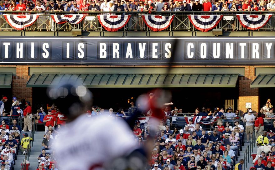 FILE - In this April 1, 2013 file photo, fans watch from the outfield as Atlanta Braves' Jason Heyward swings at a pitch in the first inning of an opening day baseball game against the Philadelphia Phillies, in Atlanta. The Atlanta Braves are leaving Turner Field and moving into a new 42,000-seat, $672 million stadium complex in Cobb County in 2017. Braves executives John Schuerholz, Mike Plant and Derek Schiller said Monday, Nov. 11, 2013, that the team decided not to seek another 20-year lease at Turner Field and began talks with the Cobb Marietta Coliseum and Exhibit Hall Authority in July.(AP Photo/David Goldman, File)