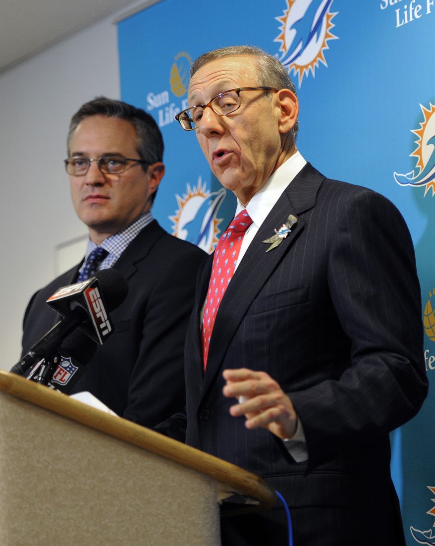 Miami Dolphins owner Stephen Ross, right, and CEO Tom Garfinkel address the media before an NFL football game against the Tampa Bay Buccaneers Monday, Nov. 11, 2013, in Tampa, Fla. (AP Photo/Brian Blanco)