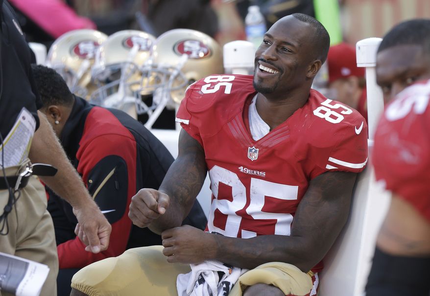San Francisco 49ers tight end Vernon Davis (85) smiles on the bench during the fourth quarter of an NFL football game against the Arizona Cardinals in San Francisco, Sunday, Oct. 13, 2013. The 49ers won 32-20. (AP Photo/Marcio Jose Sanchez)