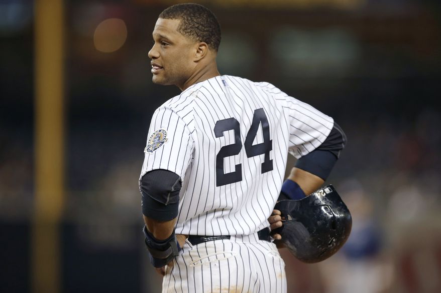 FILE - In this Sept. 25, 2013, file photo, New York Yankees' Robinson Cano looks toward the dugout during the eighth inning of the Yankees' 8-3 loss to the Tampa Bay Rays in a baseball game in New York. Representatives for the free-agent met Tuesday, Nov. 26, 2013, with the Yankees, and the gap between the sides remains wide, according to a person familiar with the negotiations. The person spoke to The Associated Press on condition of anonymity because no statements were authorized. The person adds the sides may meet again Wednesday. (AP Photo/Kathy Willens, File)