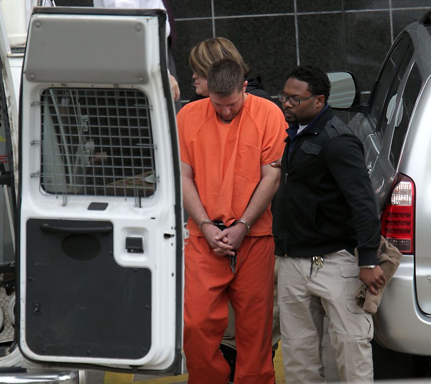 Conrad Alvin Barrett, 27, is escorted out of the Bob Casey Federal Courthouse Friday, Dec. 27,2 013, in Houston. Barrett was arrested the day before on federal hate crimes charges for allegedly shooting video of himself sucker-punching a 79-year-old black man in a "knockout game"-style attack. According to prosecutors, the attack happened Nov. 24 in Katy, but it wasn't until 12 days later that authorities connected the attack to the cellphone video of it. (AP Photo/Houston Chronicle, James Nielsen) MANDATORY CREDIT
