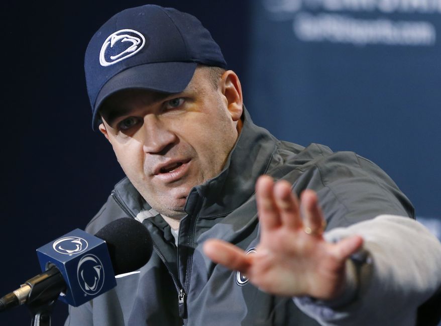 FILE - In this April 20, 2013, file photo, Penn State coach Bill O'Brien answers questions during a news conference in State College, Pa. Two people familiar with the negotiations said Tuesday night, Dec. 31, 2013, that O'Brien has reached an agreement to coach the Houston Texans. The people spoke to The Associated Press on the condition of anonymity because an official announcement hasn't been made. (AP Photo/Keith Srakocic)