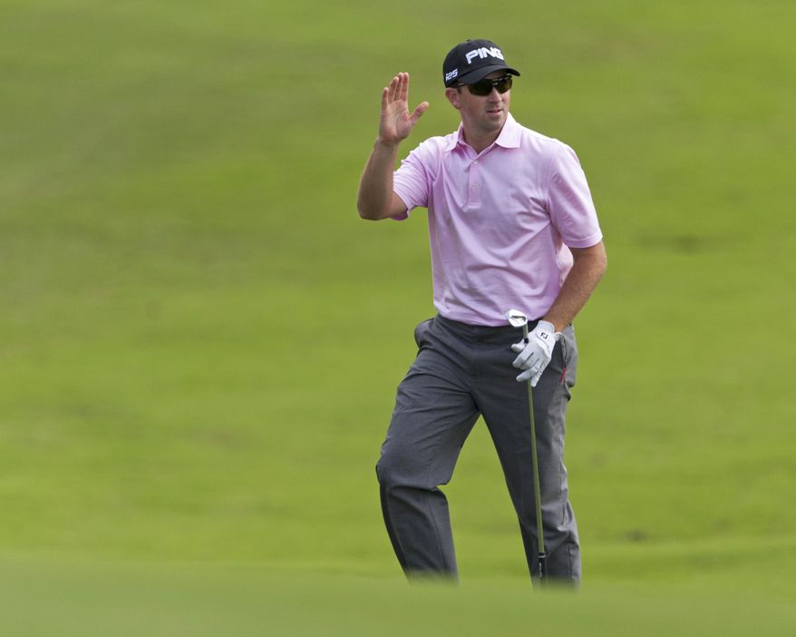 Michael Thompson waves to the gallery after hitting from the 18th fairway during the first round of the Tournament of Champions golf tournament, Friday, Jan. 3, 2014, in Kapalua, Hawaii. (AP Photo/Marco Garcia)