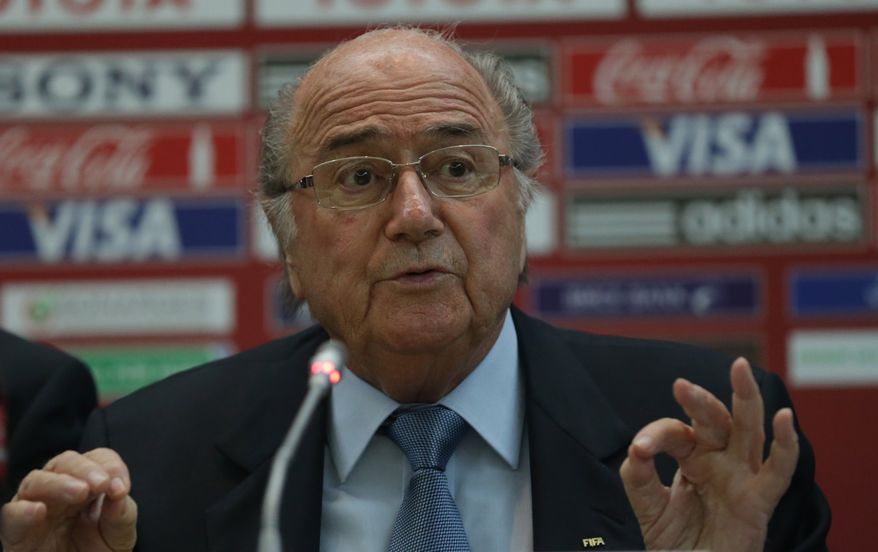 FIFA president Joseph Sepp Blatter attends a news conference at the Club World Cup soccer tournament in Marrakech, Morocco, Thursday, Dec. 19, 2013. (AP Photo/Matthias Schrader)