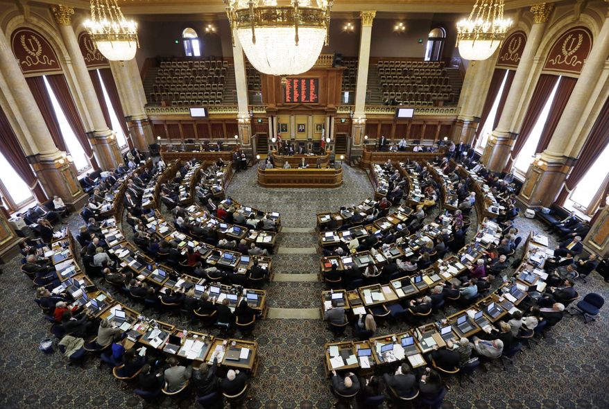 Republican House Speaker Kraig Paulsen, center, of Hiawatha, delivers his remarks during the opening day of the Iowa Legislature, Monday, Jan. 13, 2014, at the Statehouse in Des Moines, Iowa. (AP Photo/Charlie Neibergall)