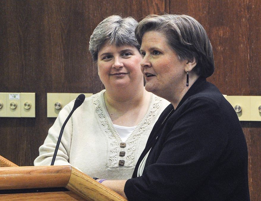 FILE - In this Oct. 10, 2013 file photo, Sharon Baldwin, left, and Mary Bishop speak at East Central University in Ada, Okla., as part of the ECU Gay-Straight Alliance's National Coming Out Day event. A federal judge on Tuesday, Jan. 14, 2014 struck down Oklahoma's gay marriage ban, saying it violates the U.S. Constitution, but immediately stayed the effects of the ruling while the courts sort out the matter. (AP Photo/Eric Turner)