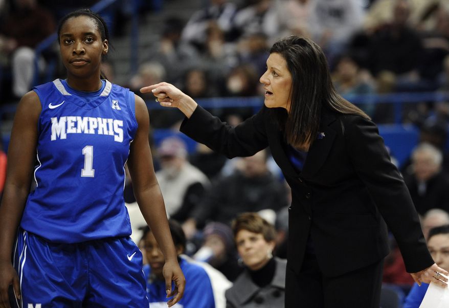 Memphis coach Melissa McFerrin, right, speaks to Breigha Wilder-Cochran during the first half of an NCAA college basketball game against Connecticut, Wednesday, Jan. 22, 2014, in Hartford, Conn. (AP Photo/Jessica Hill)