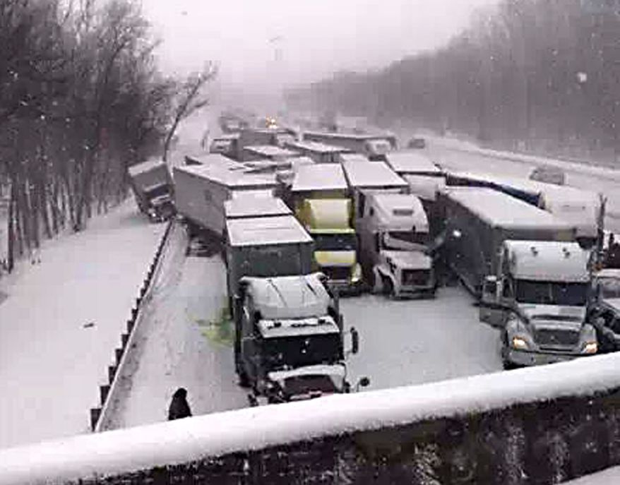 This cell phone image shows a massive highway pileup on Interstate 94 near Michigan City, Ind., Thursday, Jan. 23, 2014, that is being blamed on whiteout conditions. The accident has left at least two people dead and an unknown number injured in northwestern Indiana. Indiana State Police say they have closed Interstate 94 eastbound and are bringing in cranes and wreckers to help clear the scene. (AP Photo/Sun-Times Media, Matt Carpenter)