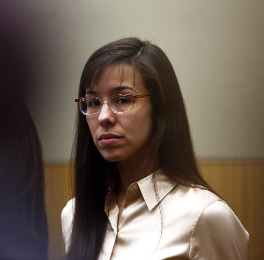 File-This May 15, 2013, file pool photo shows Jodi Arias looking at the family of Travis Alexander as the jury arrives during the sentencing phase of her trial at Maricopa County Superior Court in Phoenix. Arias' legal bills have topped $2 million, a tab being footed by Arizona taxpayers that will only continue to climb with a new penalty phase set for March, officials said Monday Jan. 27, 2014. (AP Photo/The Arizona Republic, Rob Schumacher, File)