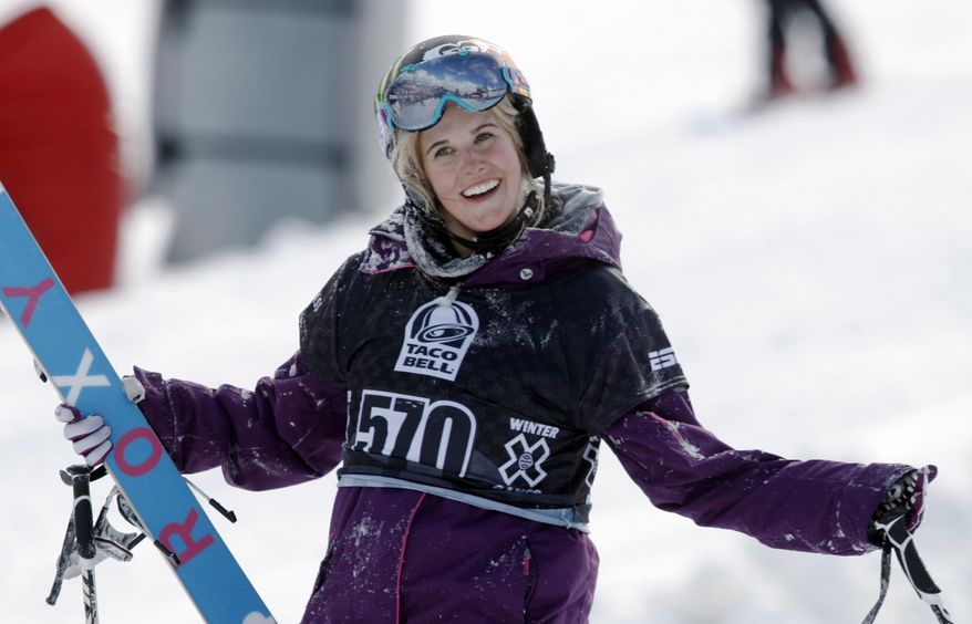 FILE - In a Jan. 28, 2010, file photo, Sarah Burke, of Canada, reacts after failing to place in the top-three finishers in the slopestyle skiing women's final at the Winter X Games at Buttermilk Mountain outside Aspen, Colo. Burke died Jan. 19, 2012, nine days after a training accident on a halfpipe in Park City, Utah, and about nine months after the International Olympic Committee said "yes" to her longtime dream. Burke's friends will bring their snowflakes to the Olympic Games in Sochi, Russia, wearing necklaces shaped like the snowflake tattoo the late Canadian star had etched on her foot. (AP Photo/David Zalubowski, File)