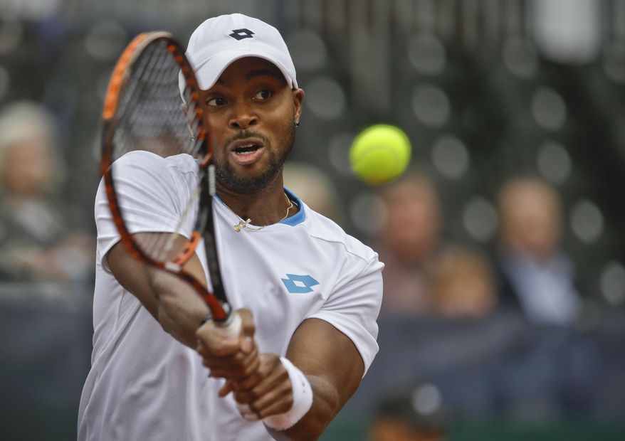 Donald Young, of the United States, returns a shot against Britain's Andy Murray during a Davis Cup tennis match at Petco Park Friday, Jan. 31, 2014, in San Diego. Murray won the match 6-1, 6-2, 6-3. (AP Photo/Lenny Ignelzi)