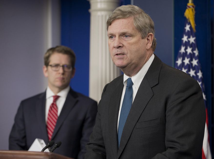 Agriculture Secretary Tom Vilsack, right, accompanied by White House press secretary Jay Carney, announces new climate zones to help farmers deal with climate change, Wednesday, Feb. 5, 2014, during the daily news briefing at the White House in Washington. Aiming to help rural communities deal with climate change, the Obama administration is creating seven regional "climate hubs" that will serve as clearinghouses for information and outreach about extreme weather across the US. (AP Photo/Pablo Martinez Monsivais)