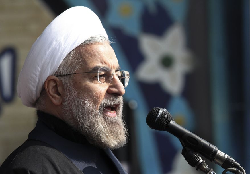 ** FILE ** Iranian President Hassan Rouhani, delivers a speech during an annual rally commemorating anniversary of the 1979 Islamic revolution, at the Azadi 'Freedom' Square in Tehran, Iran, Tuesday, Feb. 11, 2014. (AP Photo/Vahid Salemi)