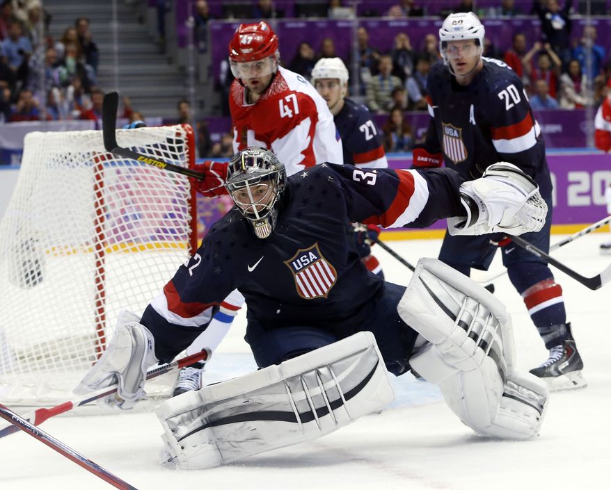 USA goaltender Jonathan Quick comes out of the crease to defend the goal in the third period of a men's ice hockey game at the 2014 Winter Olympics, Saturday, Feb. 15, 2014, in Sochi, Russia. (AP Photo/Mark Humphrey)